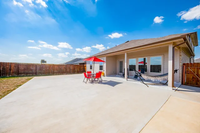 a view of a swimming pool and front door