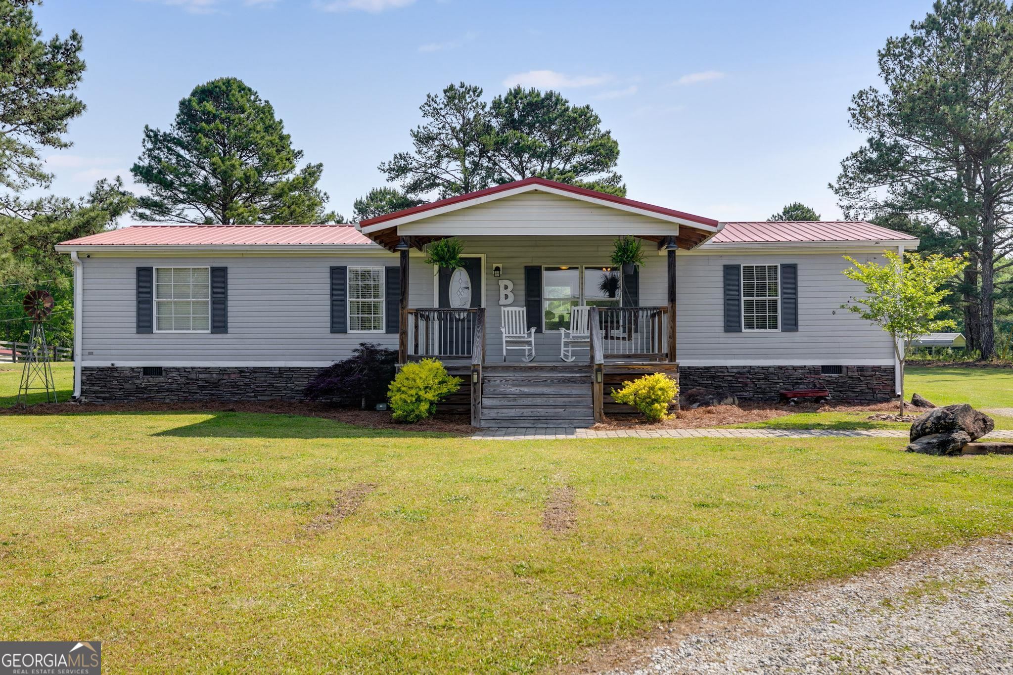 3495 Bevis Road Franklin, GA 30217 - Photo 1 of 1 a view of a house with swimming pool and porch