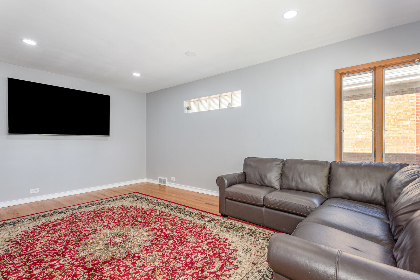 8108 North Overhill Avenue Niles, IL 60714 - Photo 5 of 18 a living room with furniture and a flat screen tv