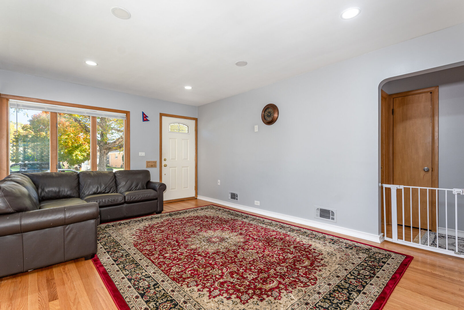 8108 North Overhill Avenue Niles, IL 60714 - Photo 6 of 18 a living room with furniture and a rug