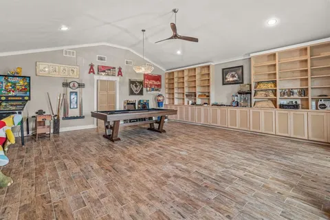 a room with furniture and air hockey table