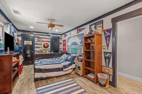 a bathroom with a granite countertop sink mirror and shower