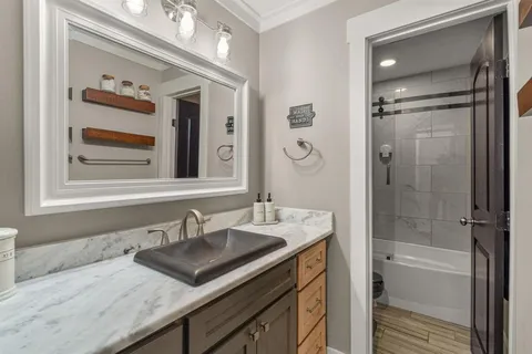 a kitchen with stainless steel appliances a sink a stove and a refrigerator