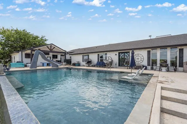 a bathroom with a shower and a sink