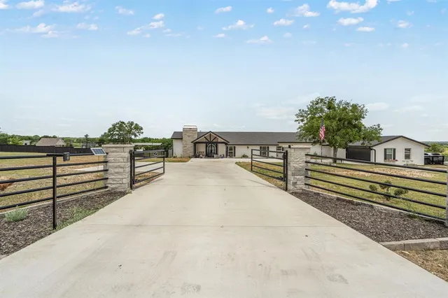 a view of a balcony with two chairs