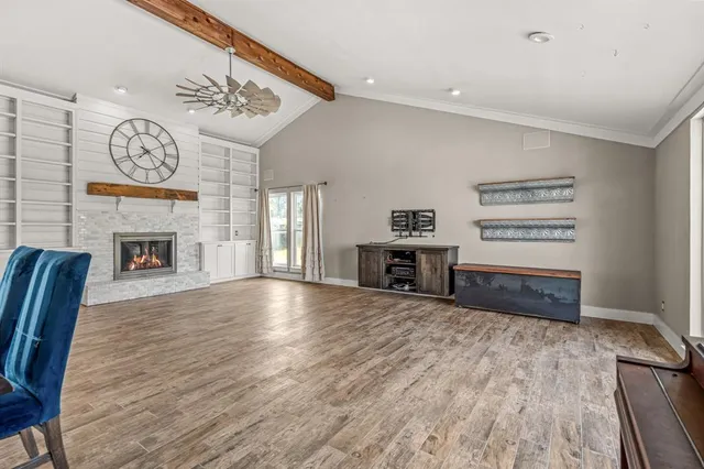 a view of a livingroom with furniture and a fireplace