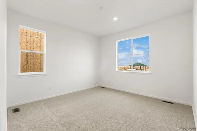 an empty room with windows