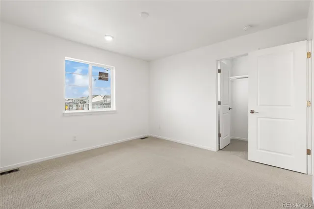 an empty room with a hallway