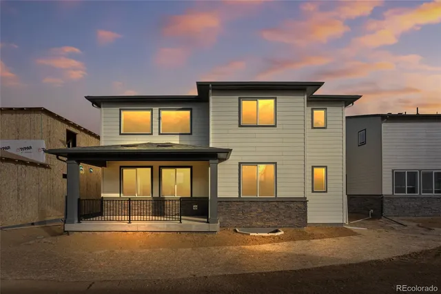 a front view of a house with a garage