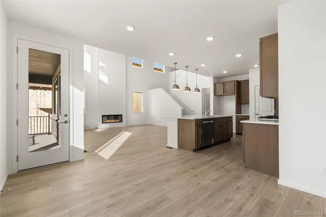 a view of kitchen with cabinets and wooden floor