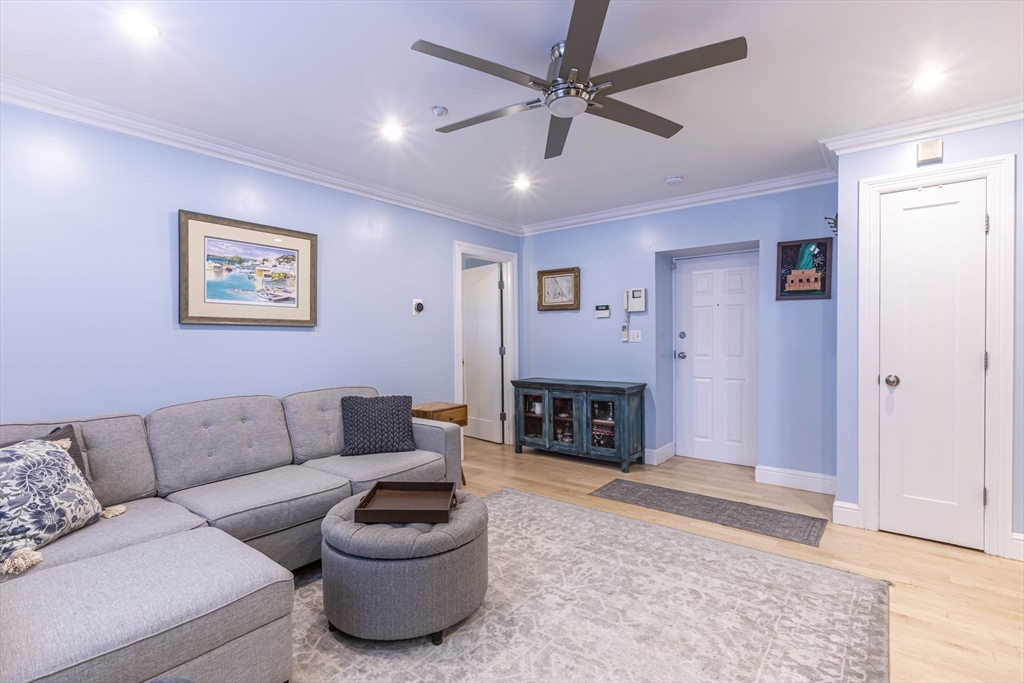 52 Cooper Street, Unit 2 Boston, MA 02113 - Photo 7 of 15 a living room with furniture and a fireplace