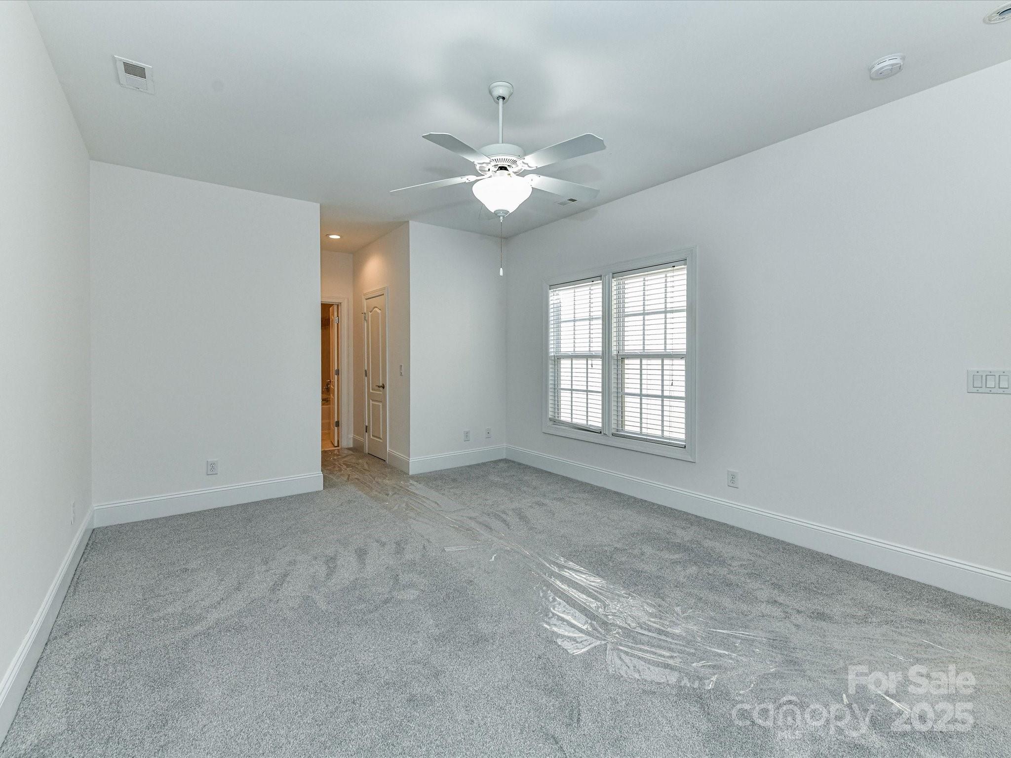 155 Harper Lee Street Davidson, NC 28036 - Photo 13 of 26 a view of an empty room with a window