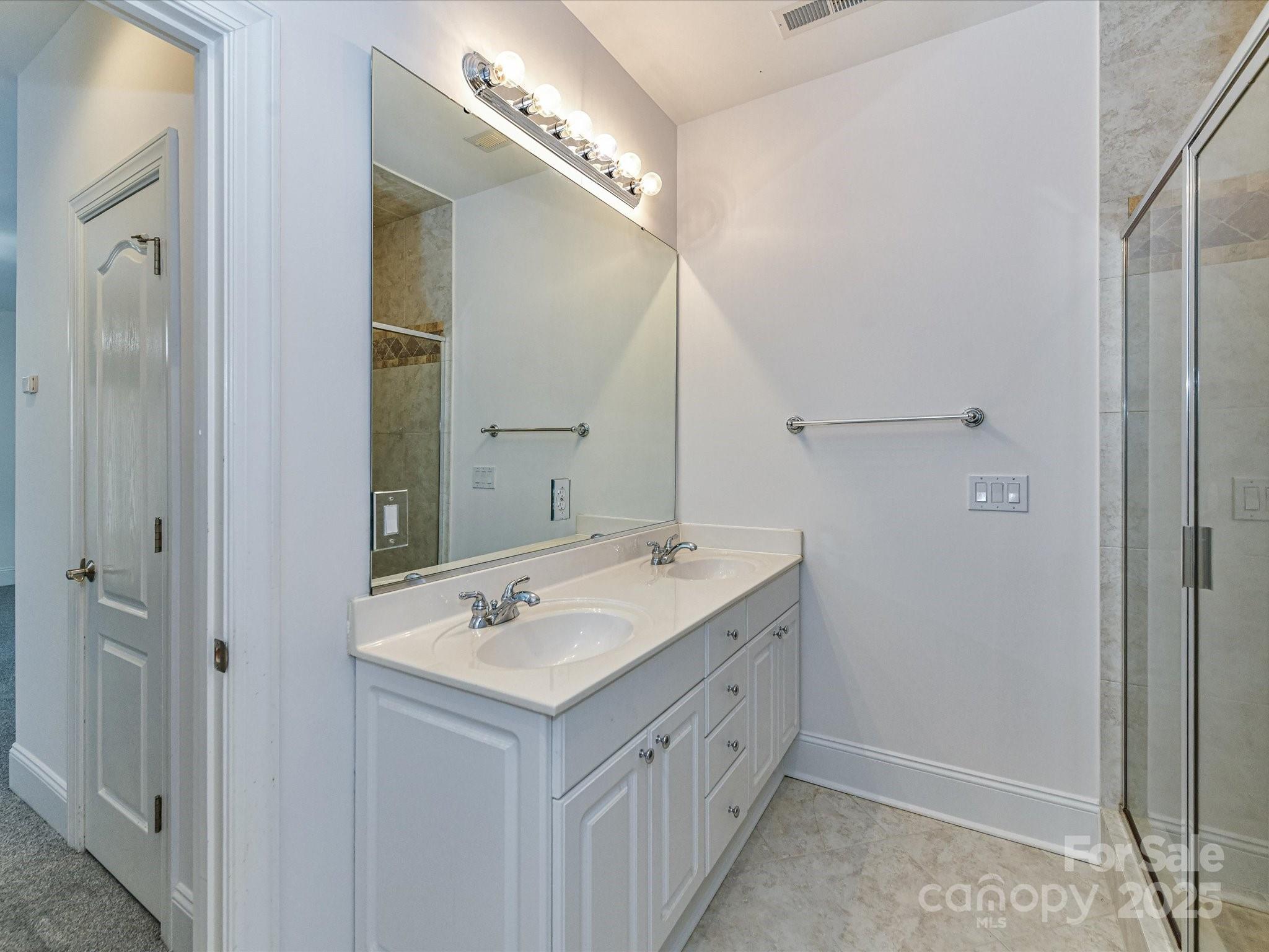 155 Harper Lee Street Davidson, NC 28036 - Photo 15 of 26 a bathroom with a sink and a mirror