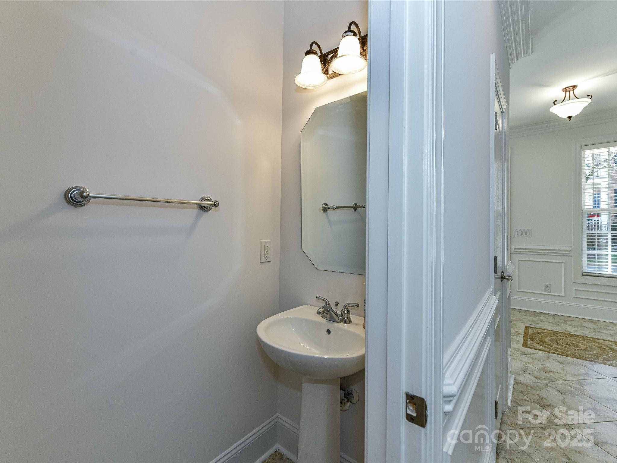155 Harper Lee Street Davidson, NC 28036 - Photo 17 of 26 a bathroom with a sink a toilet and shower
