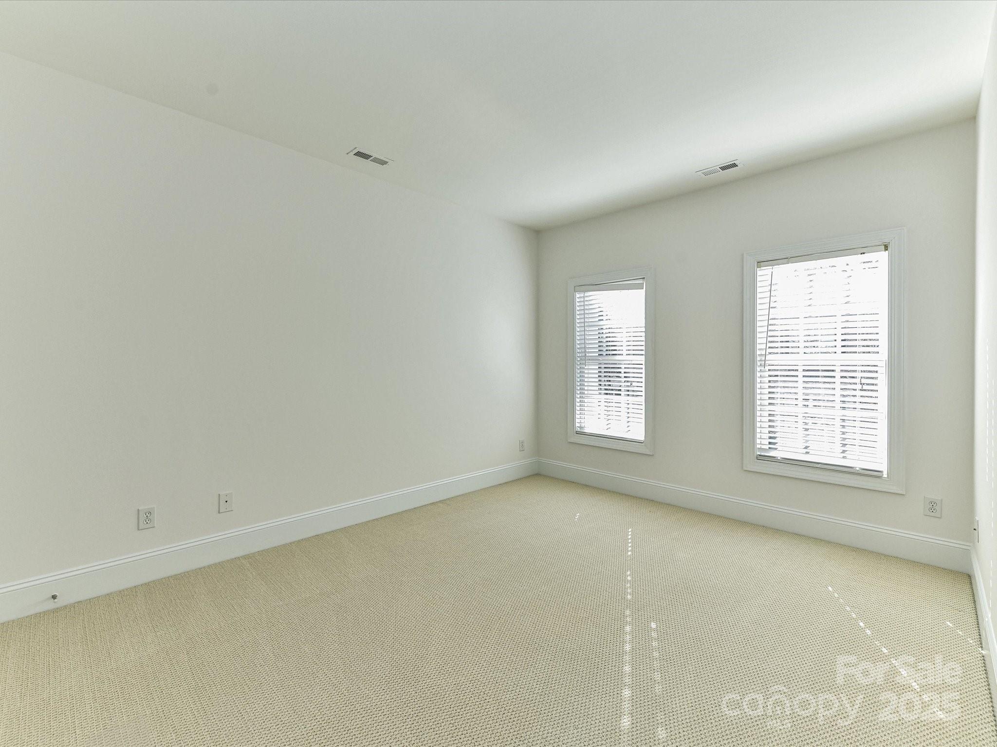 155 Harper Lee Street Davidson, NC 28036 - Photo 21 of 26 an empty room with a window