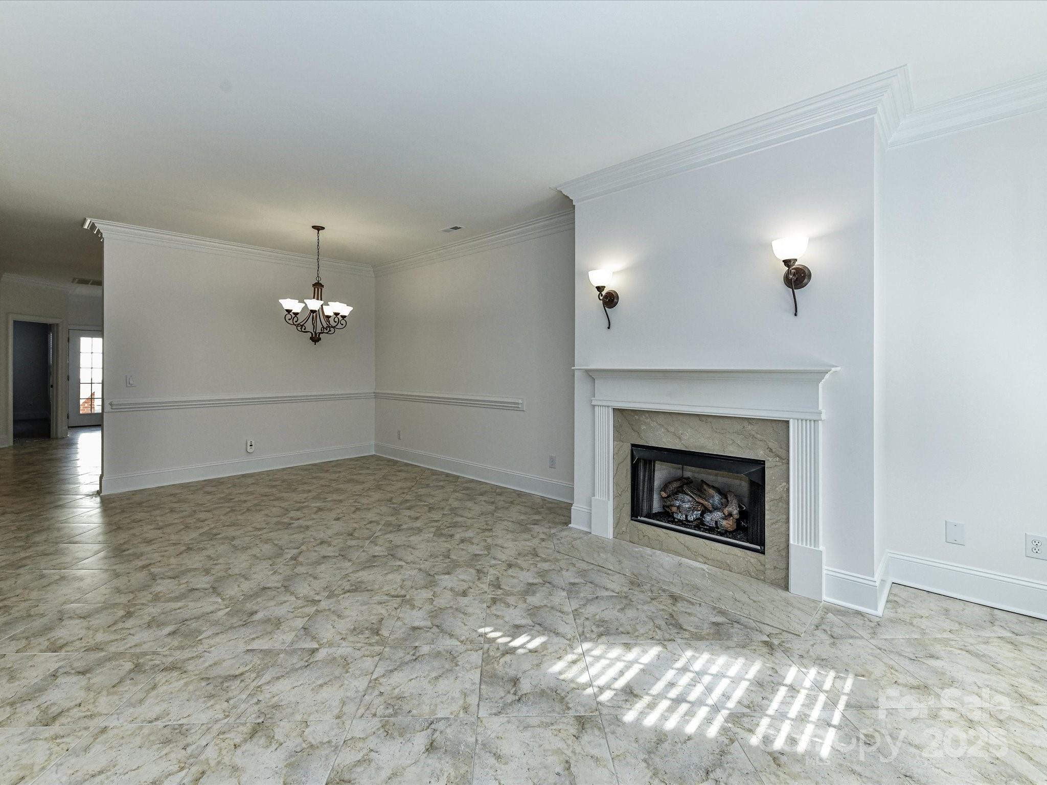 155 Harper Lee Street Davidson, NC 28036 - Photo 5 of 26 a view of empty room with a fireplace