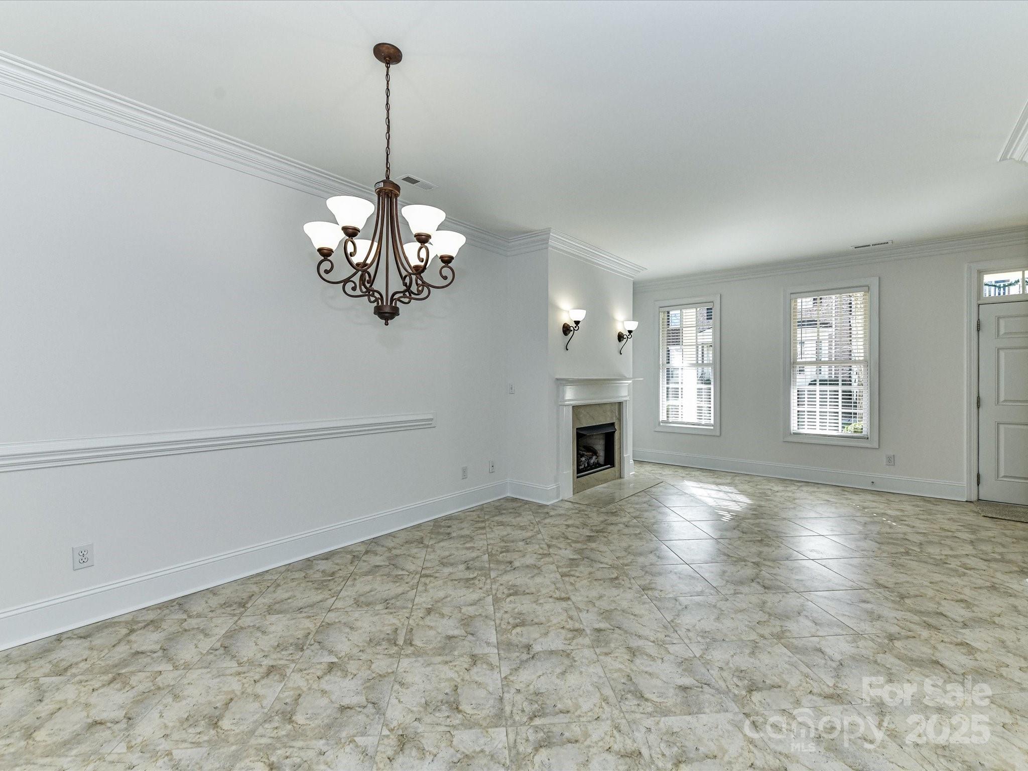 155 Harper Lee Street Davidson, NC 28036 - Photo 6 of 26 a view of a chandelier in a room with a chandelier
