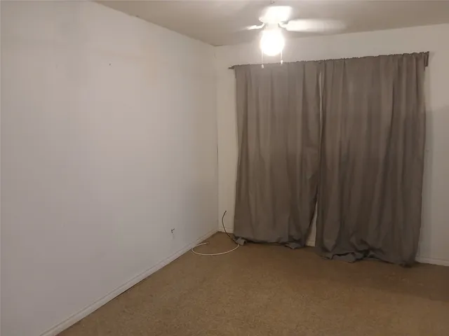a view of a closet with wooden floor