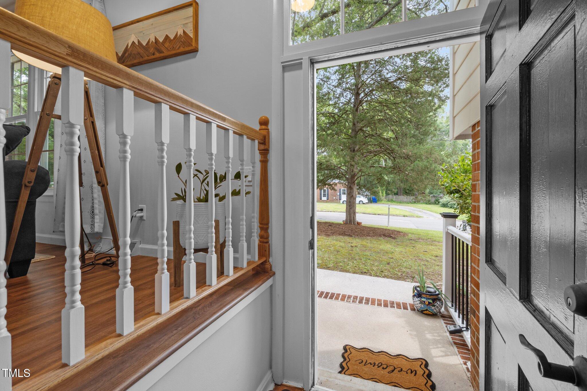 1205 Willow Drive Chapel Hill, NC 27517 - Photo 8 of 45 a view of a porch with a floor to ceiling window