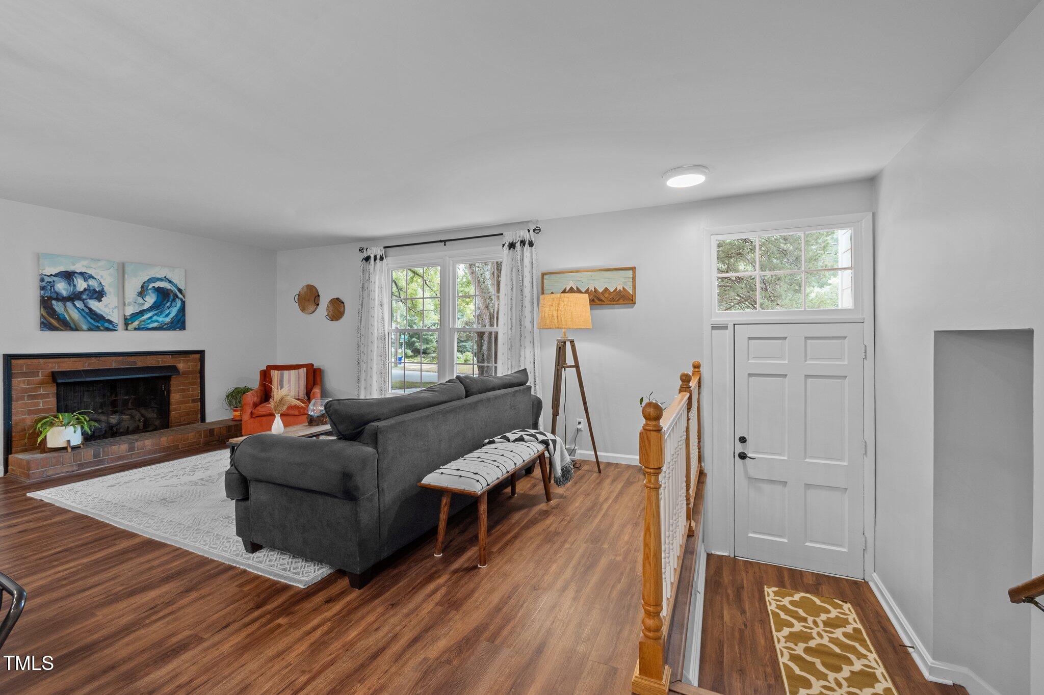 1205 Willow Drive Chapel Hill, NC 27517 - Photo 9 of 45 a living room with furniture and a fireplace