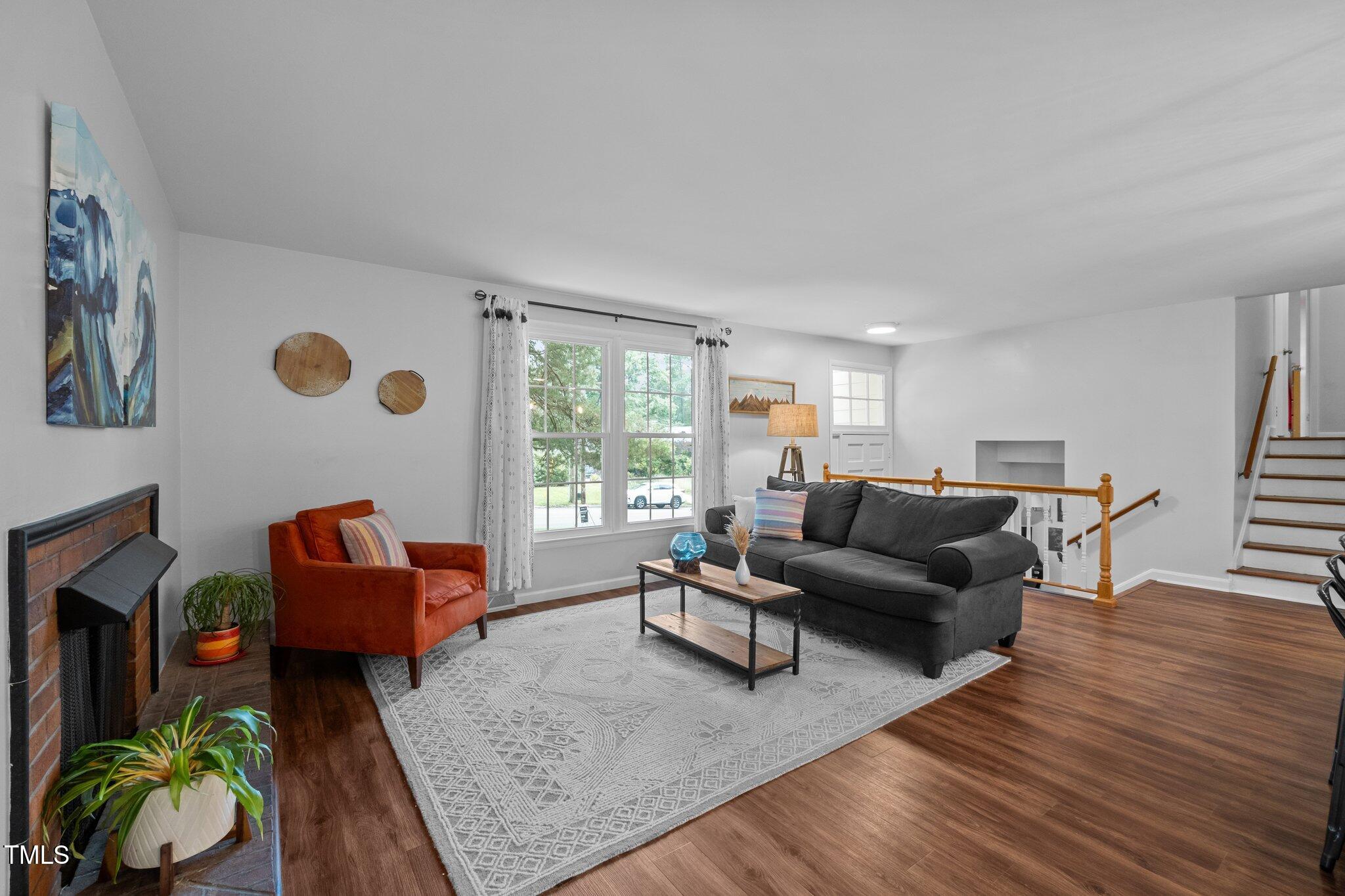 1205 Willow Drive Chapel Hill, NC 27517 - Photo 11 of 45 a living room with furniture and wooden floor