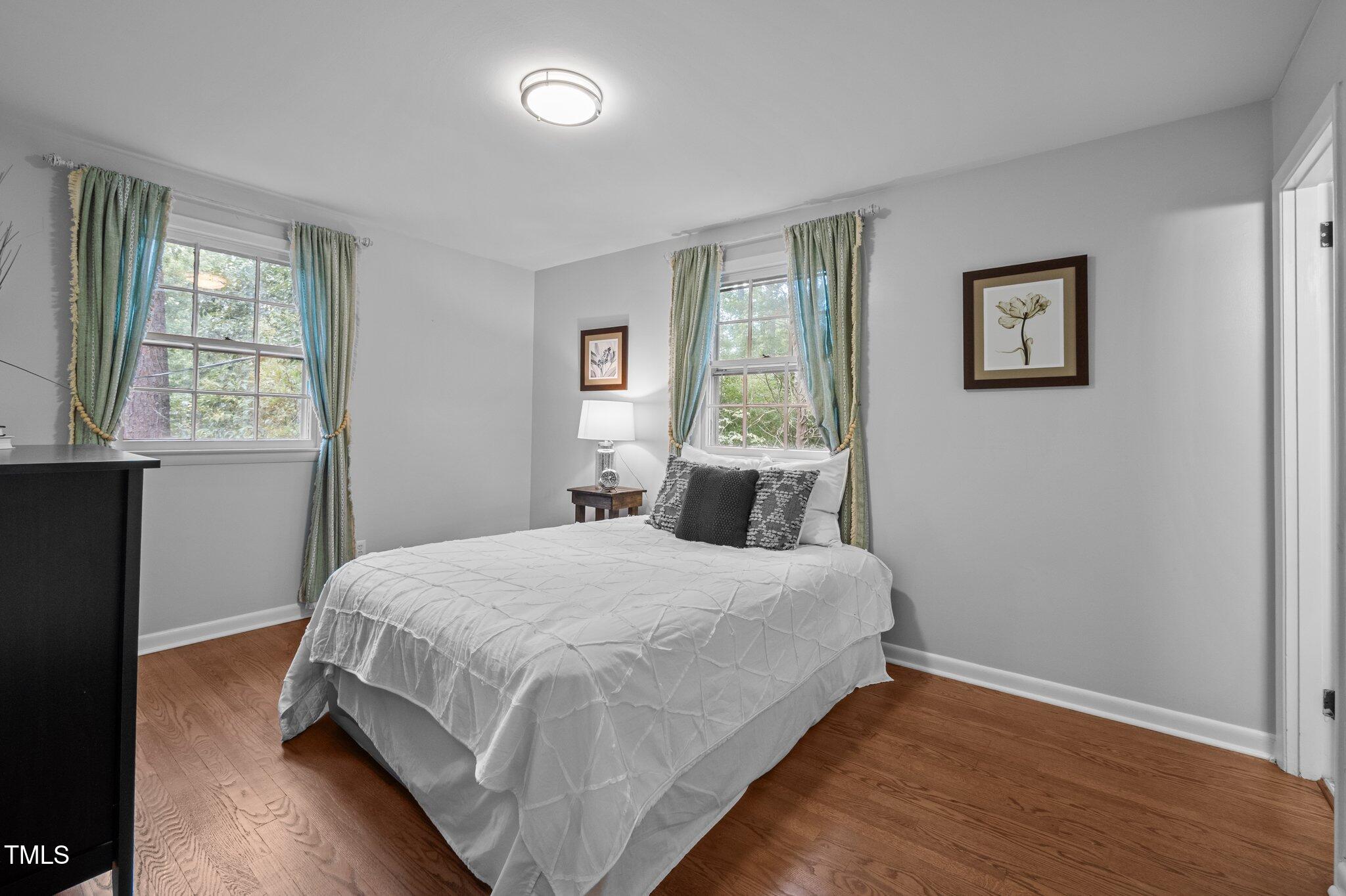 1205 Willow Drive Chapel Hill, NC 27517 - Photo 16 of 45 a bedroom with a bed and a window