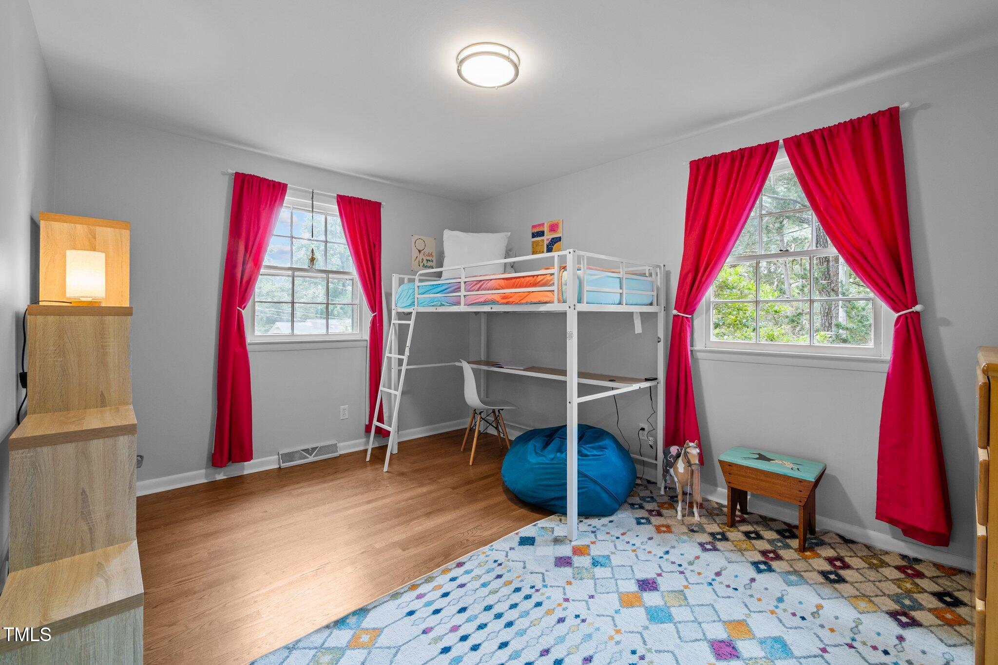 1205 Willow Drive Chapel Hill, NC 27517 - Photo 18 of 45 a view of a room with window and hardwood