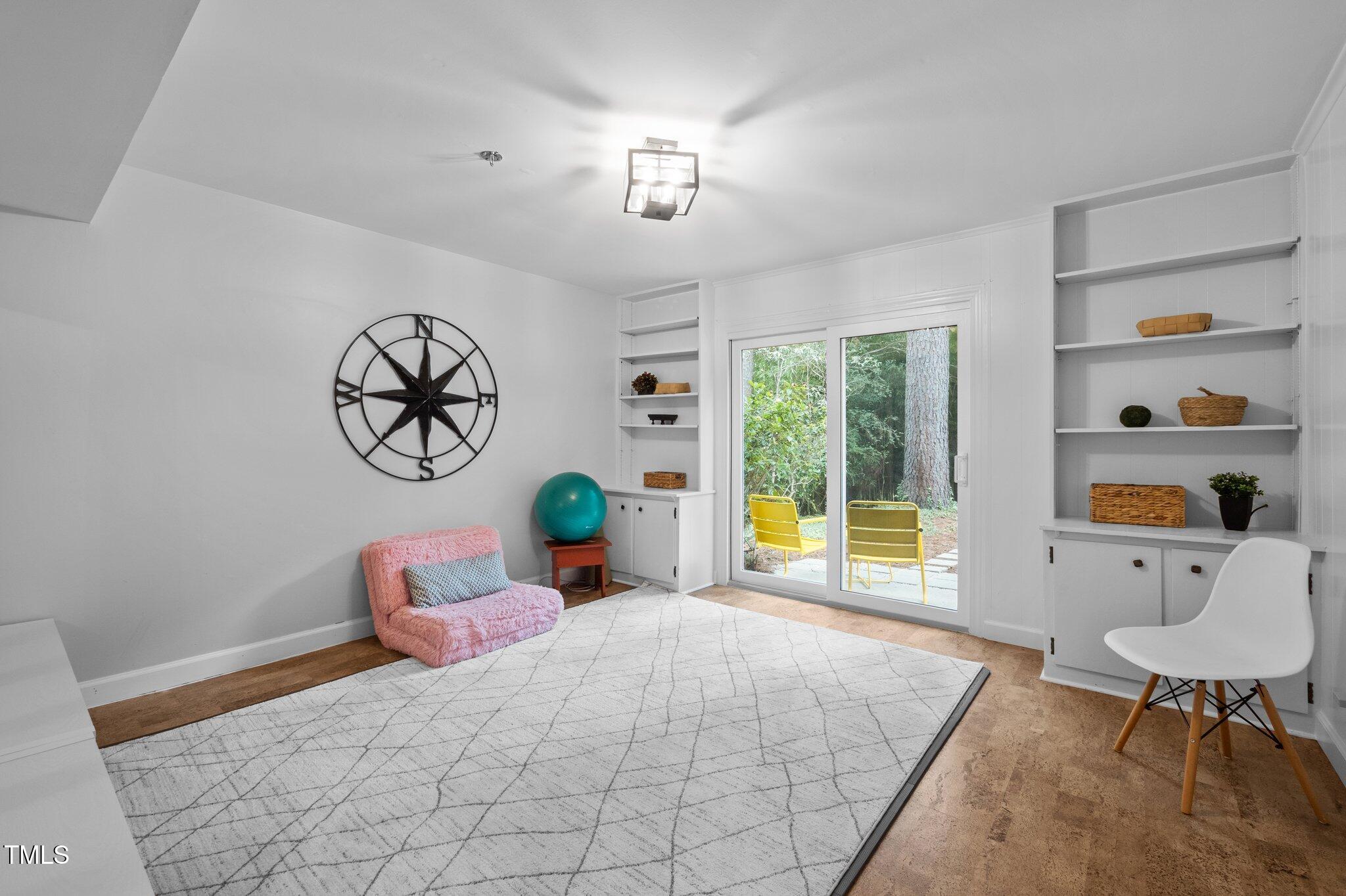 1205 Willow Drive Chapel Hill, NC 27517 - Photo 25 of 45 a bedroom with furniture and a window