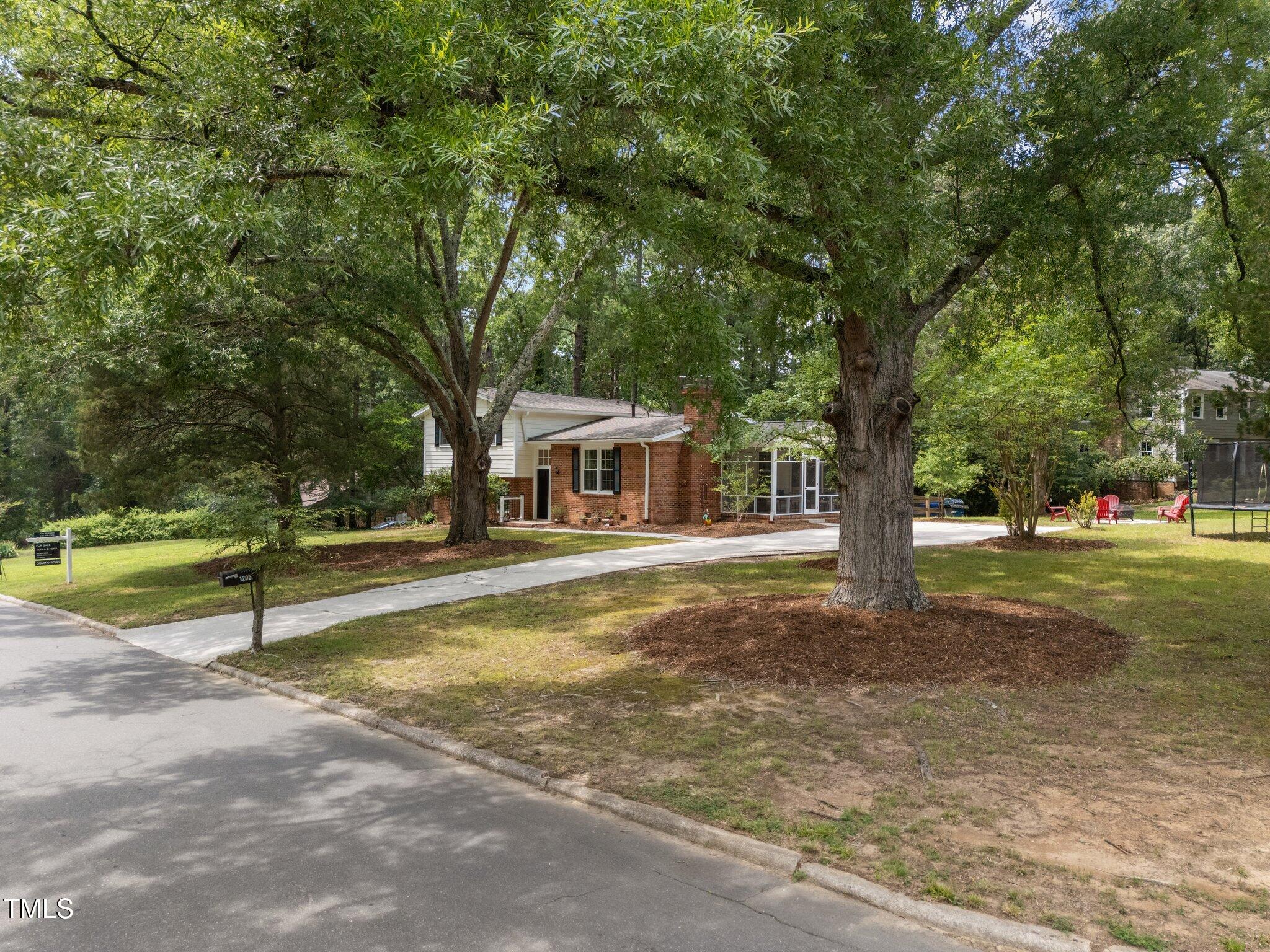 1205 Willow Drive Chapel Hill, NC 27517 - Photo 29 of 45 a view of a house with a tree in the background