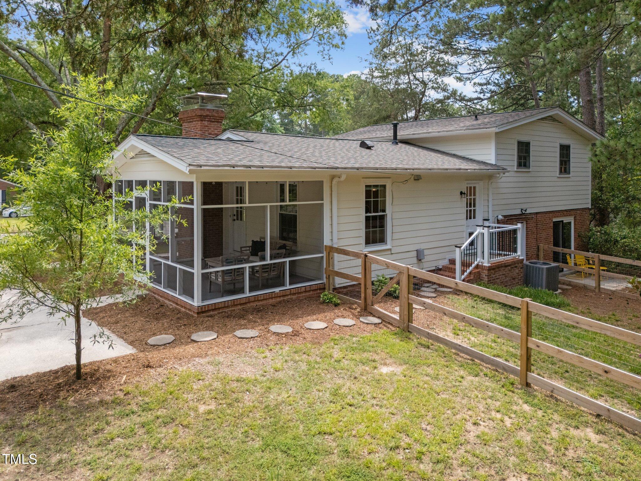 1205 Willow Drive Chapel Hill, NC 27517 - Photo 5 of 45 a view of a house with a wooden fence