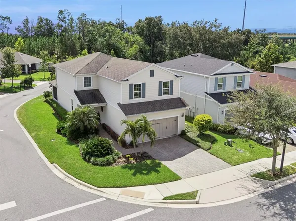 an aerial view of a house with a garden