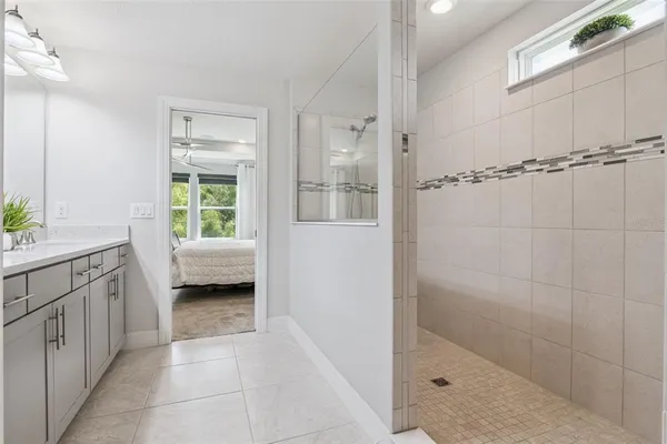 a view of a house with patio furniture and garden