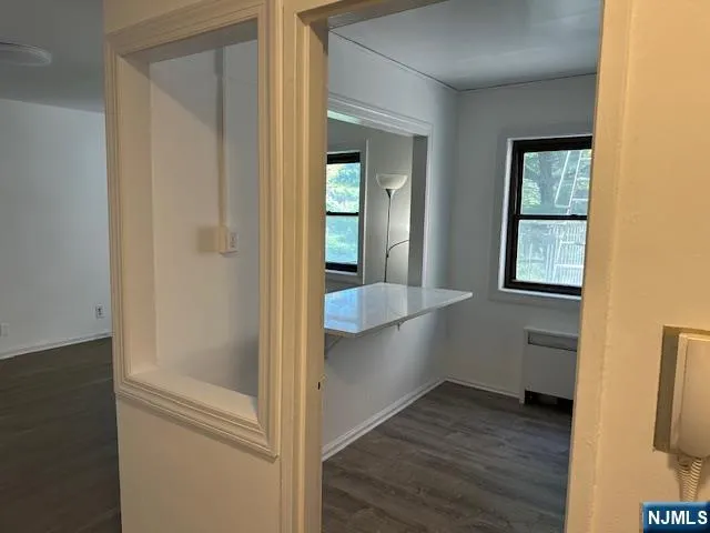 a view of gallery with wooden floor