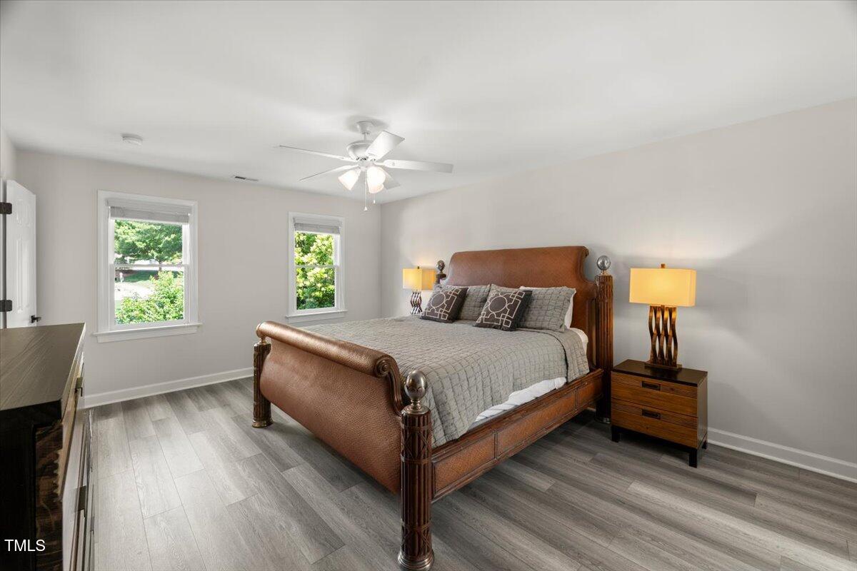 1404 Kings Lassiter Way Raleigh, NC 27614 - Photo 16 of 28 a bedroom with a bed and window