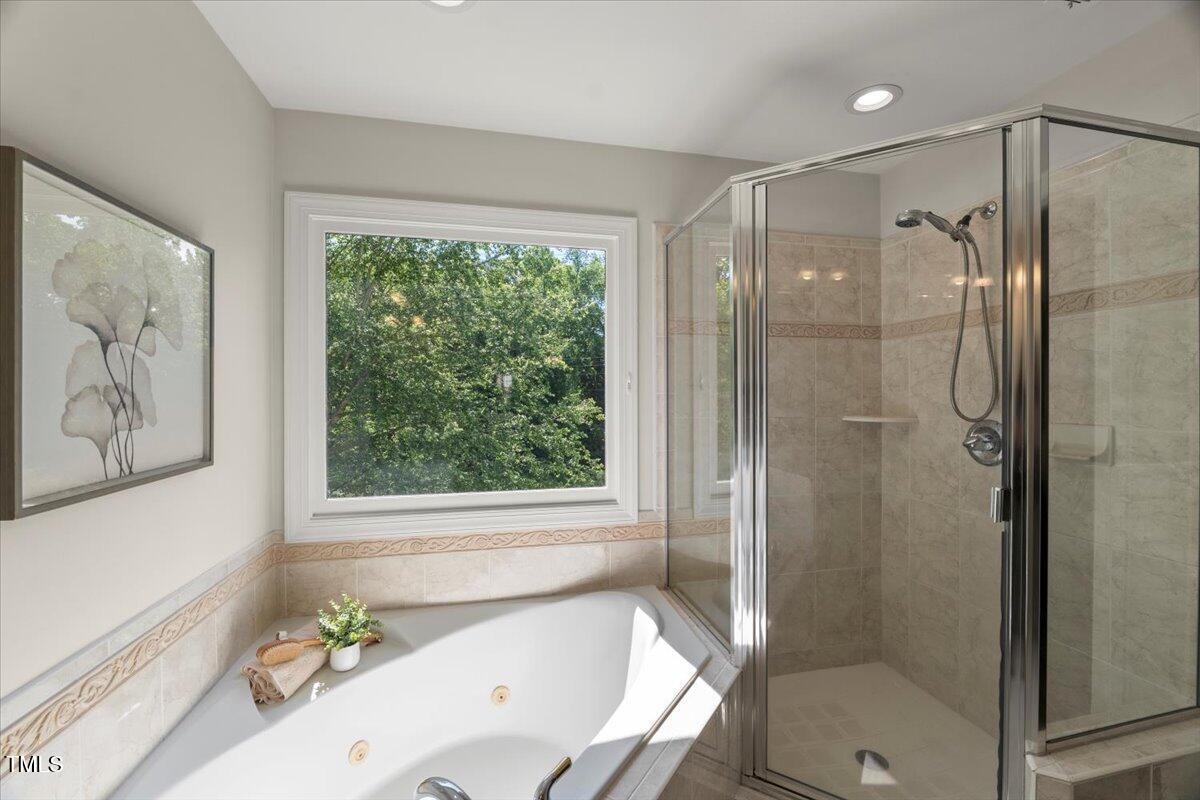 1404 Kings Lassiter Way Raleigh, NC 27614 - Photo 19 of 28 a bathroom with a tub shower and sink