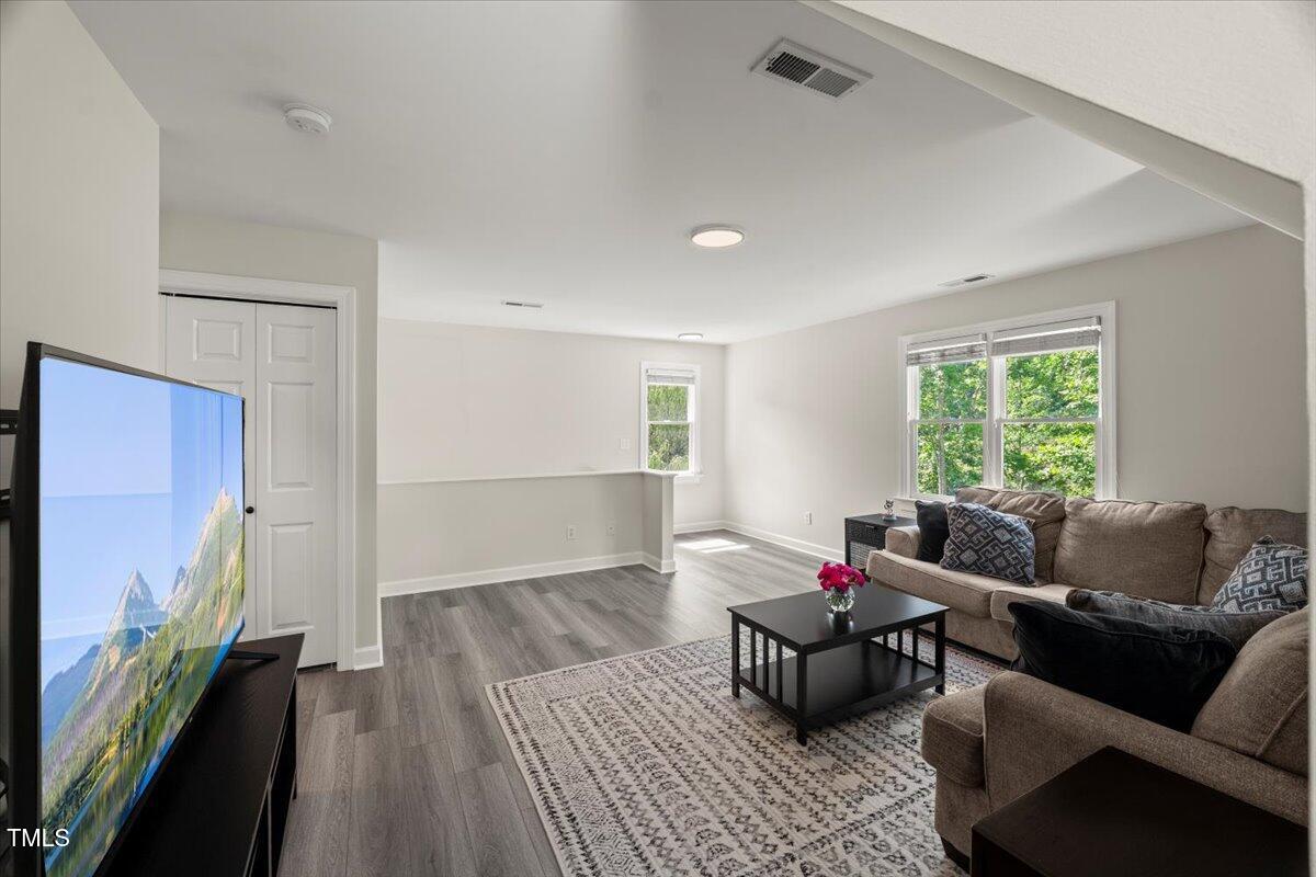1404 Kings Lassiter Way Raleigh, NC 27614 - Photo 22 of 28 a living room with furniture and a window