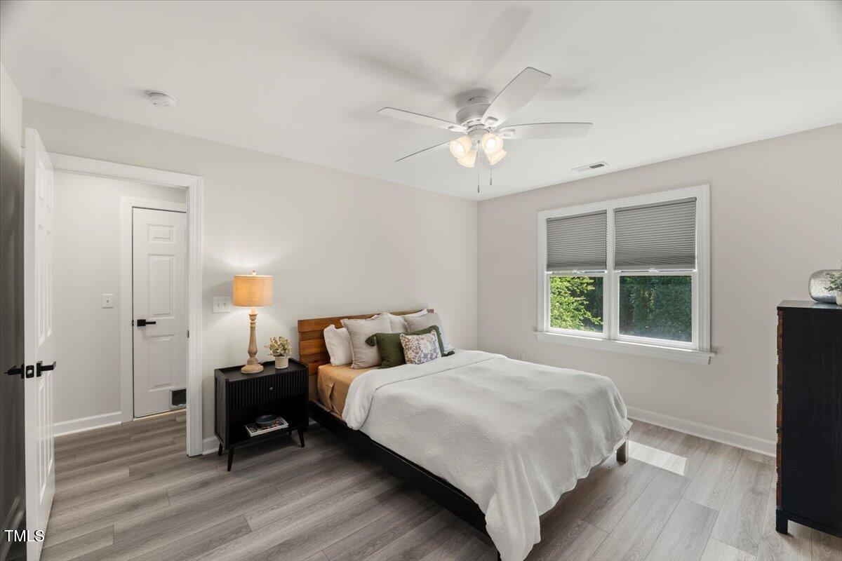 1404 Kings Lassiter Way Raleigh, NC 27614 - Photo 23 of 28 a bedroom with a bed and a window
