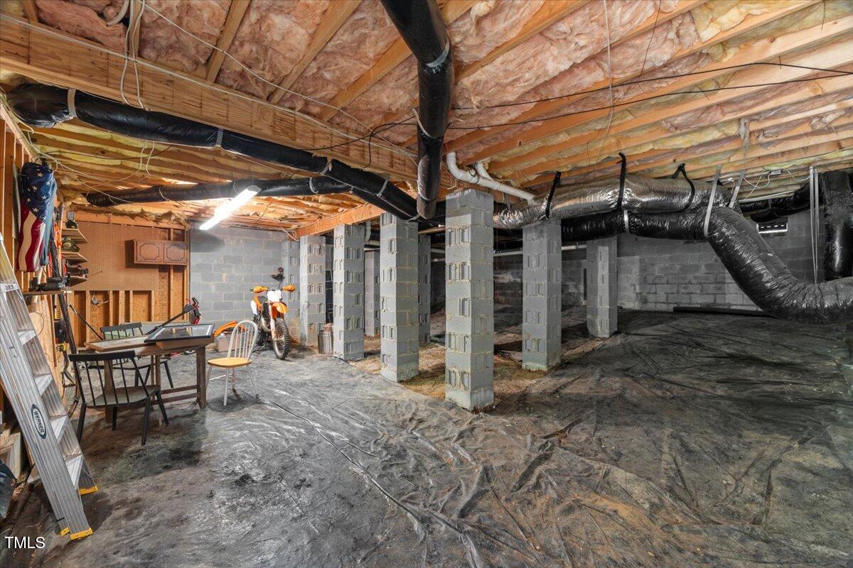 1404 Kings Lassiter Way Raleigh, NC 27614 - Photo 26 of 28 a view of an empty room with wooden floor