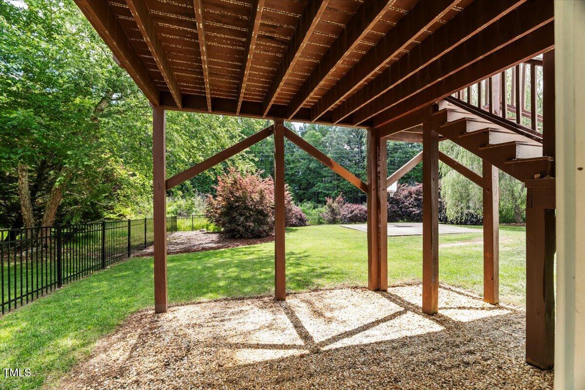 1404 Kings Lassiter Way Raleigh, NC 27614 - Photo 27 of 28 a view of a backyard with wooden floor and fence