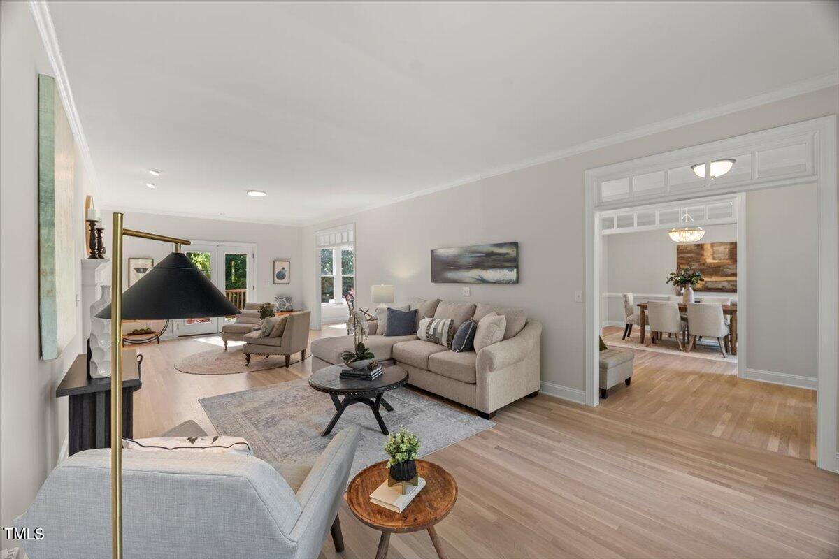 1404 Kings Lassiter Way Raleigh, NC 27614 - Photo 7 of 28 a living room with furniture and wooden floor