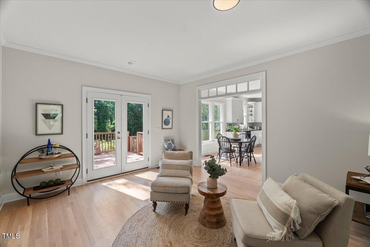 1404 Kings Lassiter Way Raleigh, NC 27614 - Photo 8 of 28 a living room with furniture and a wooden floor
