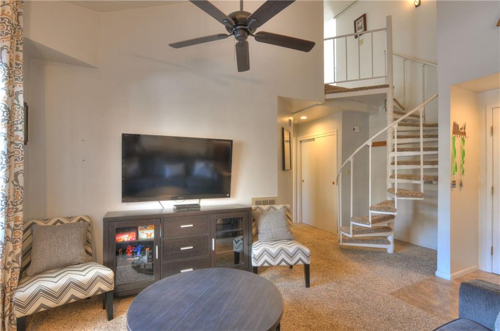 1977 Soda Ridge Road, Unit 1218 Keystone, CO 80435 - Photo 3 of 23 a living room with furniture and a flat screen tv