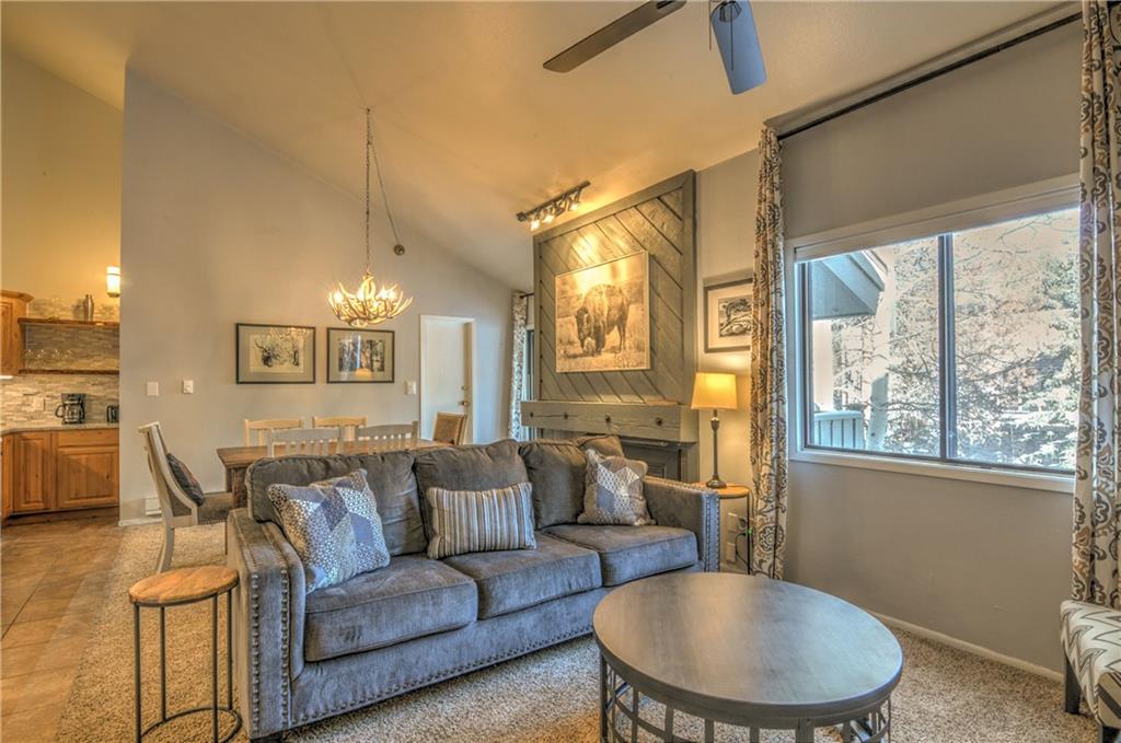 1977 Soda Ridge Road, Unit 1218 Keystone, CO 80435 - Photo 4 of 23 a living room with furniture and a large window