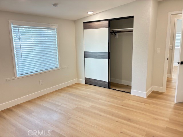 4276 Maxson Road El Monte, CA 91732 - Photo 4 of 7 a view of an empty room with wooden floor and a window