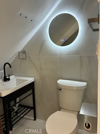 a bathroom with a toilet and a sink