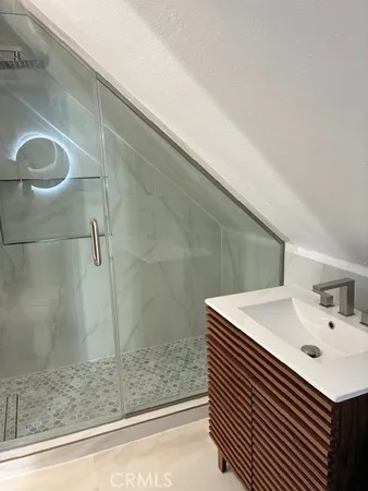 a bathroom with a sink and mirror