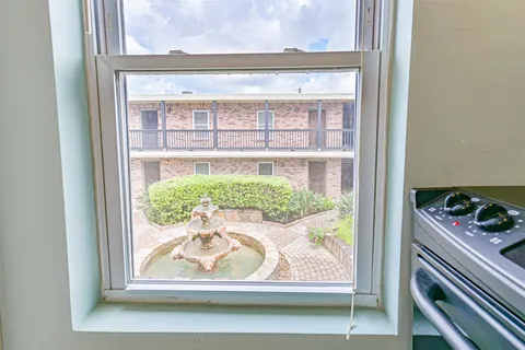 a stove top oven sitting inside of a kitchen