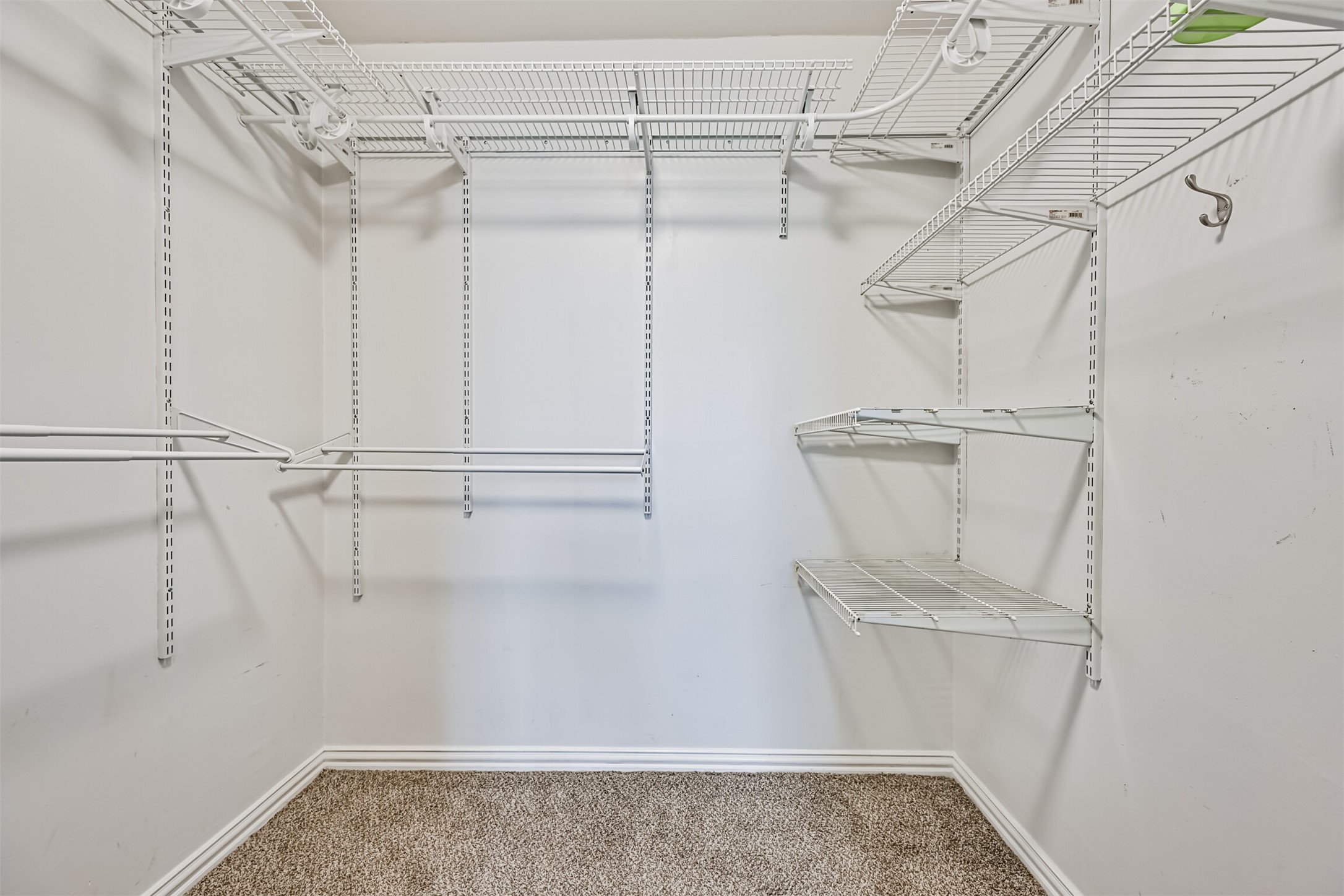 402 Postoffice Street, Unit 201 Galveston, TX 77550 - Photo 21 of 29 a view of walk in closet with empty racks