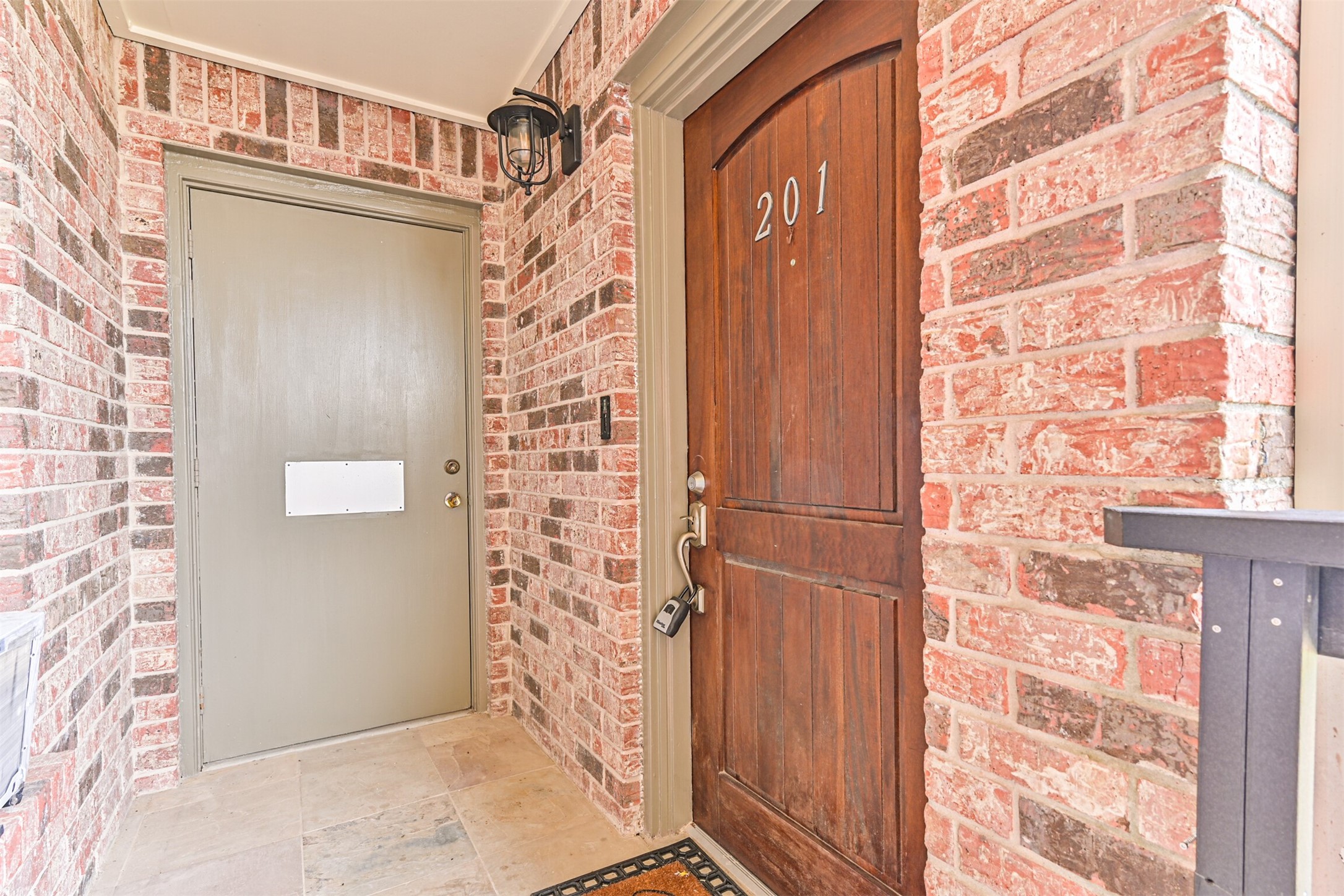 402 Postoffice Street, Unit 201 Galveston, TX 77550 - Photo 25 of 29 a bathroom with a shower curtain and a shower curtain
