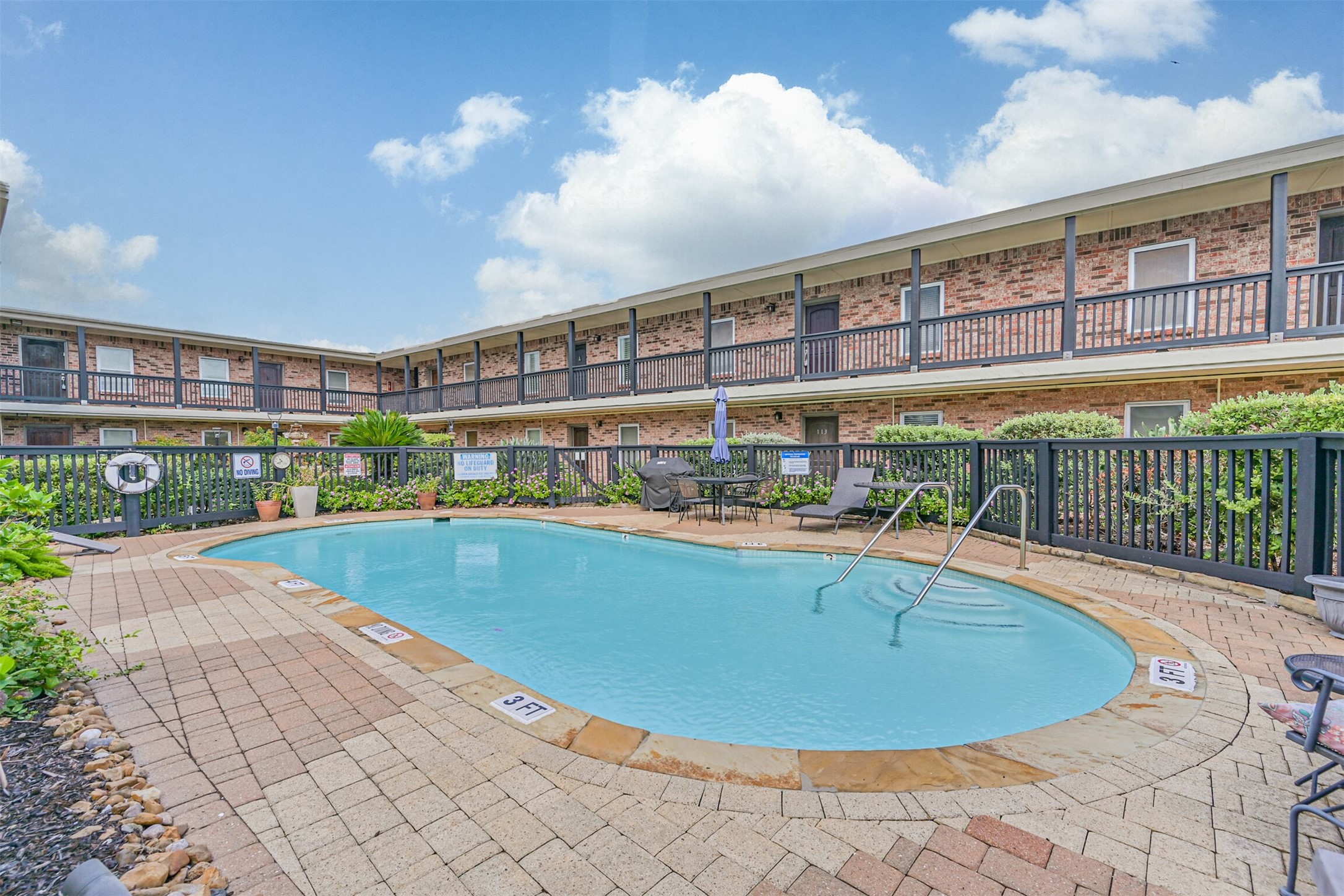 402 Postoffice Street, Unit 201 Galveston, TX 77550 - Photo 27 of 29 a view of a swimming pool and outdoor space